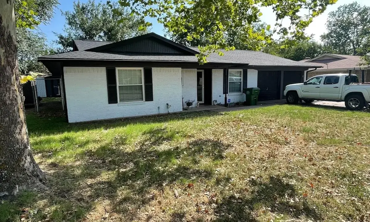 Professional roofing crew working on a residential roof in Winfield